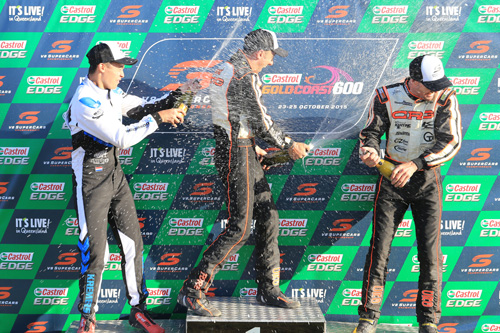 Davide Forè (centre) celebrating on the podium with Marijn Kremers (left) and Kyle Ensbey (right)