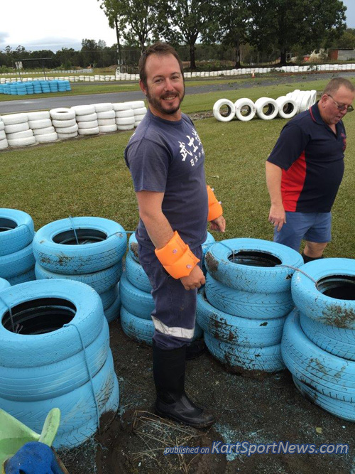 Local member Scott Davies wears floaties while rebuilding the tyre walls