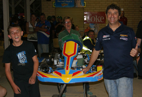 Happy faces all round as Brock Kenny accepts his new FA Kart from Remo Luciani