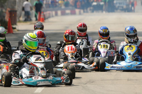 Some TAG Sr. class drivers approach the first turn at the Rock Island Grand Prix karting event - Cacciavillani (7), Taylor (342) Schuler (11), Nowysz (6) Harrington (109) and Chelootz (00)