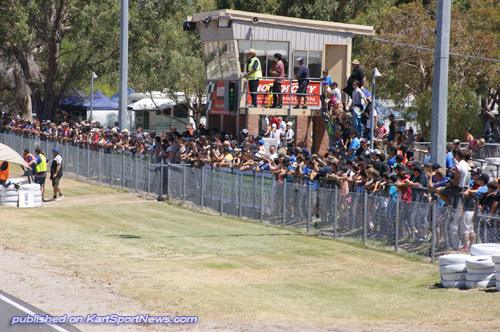 STANDING ROOM ONLY – The huge crowd lined up along the fence to watch the start of the WAKZ series, heat one