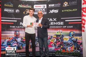Jakob Robinson and his World Finals ticket (pic - Al Ain Raceway)