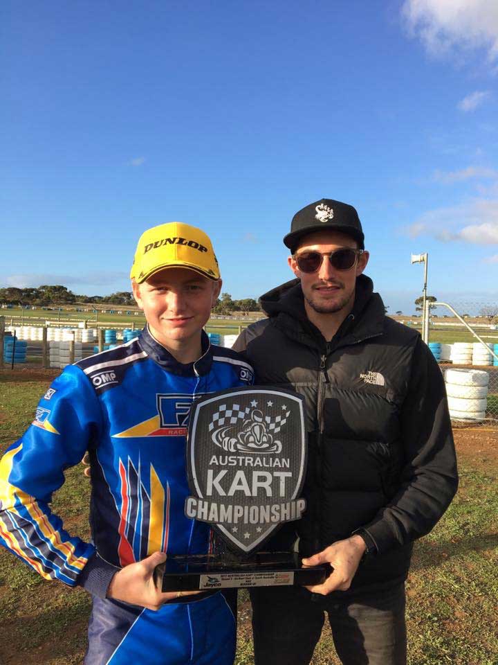 Tate Frost with driver coach Brad Jenner and the trophy from Monarto